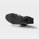 L'Artiste Shelly ankle strap sandals in Black, outsole view